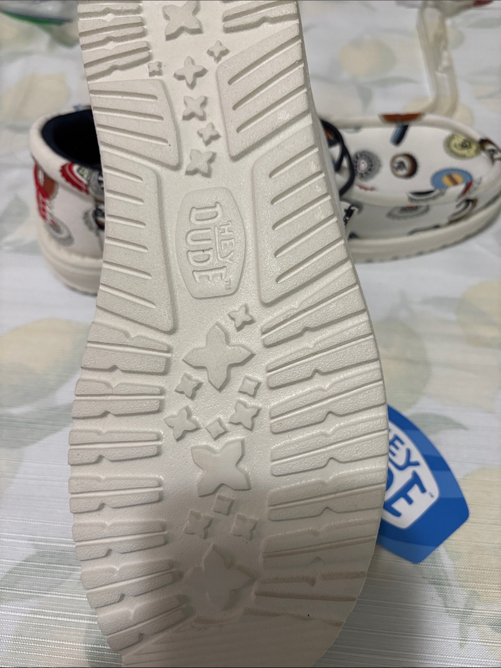 Hey Dude Men’s 8/Woman’s 10 Slip-On with Multicolor Bottle Cap Print - Picture 3 of 5